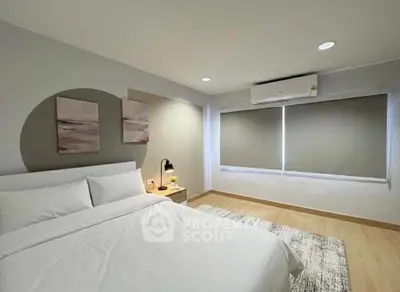 Modern bedroom with minimalist decor and natural light