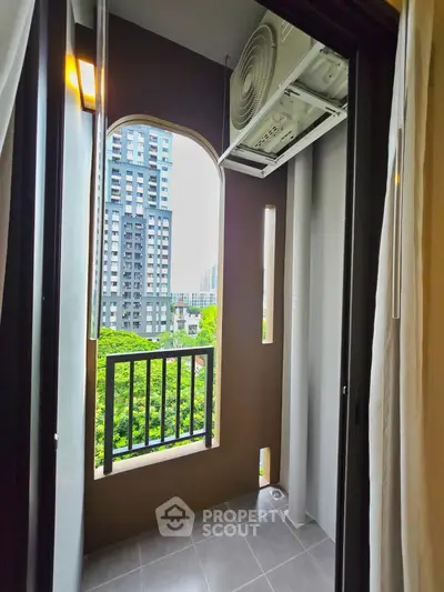 Chic urban balcony with modern city view, perfect for relaxation and enjoying the skyline.