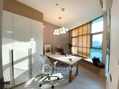 Modern study room with stylish desk, ergonomic chair, and large window with wooden blinds.
