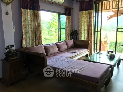 Charming living room with vintage decor and scenic garden view