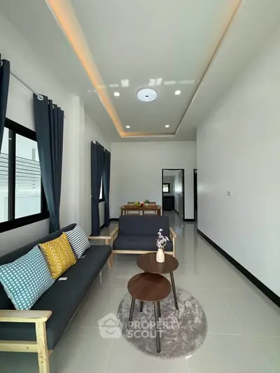 Modern living room with stylish furniture and elegant lighting in a contemporary home.