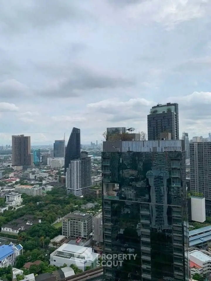 Stunning cityscape view from a high-rise building showcasing urban architecture and skyline.