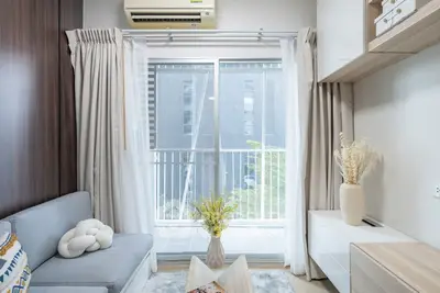 Modern living room with balcony view and stylish decor