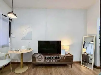 Modern living room with stylish decor and wooden flooring