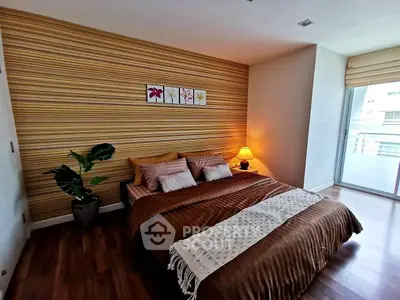 Stylish bedroom with cozy decor and large window for natural light