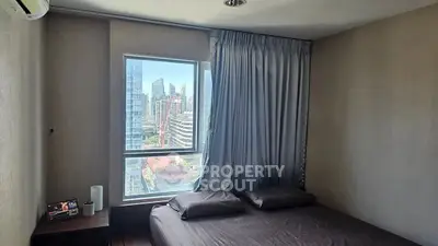 Modern bedroom with city view and sleek decor