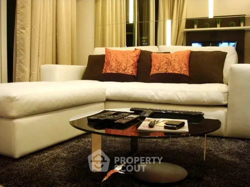Stylish modern living room with white sectional sofa and chic decor
