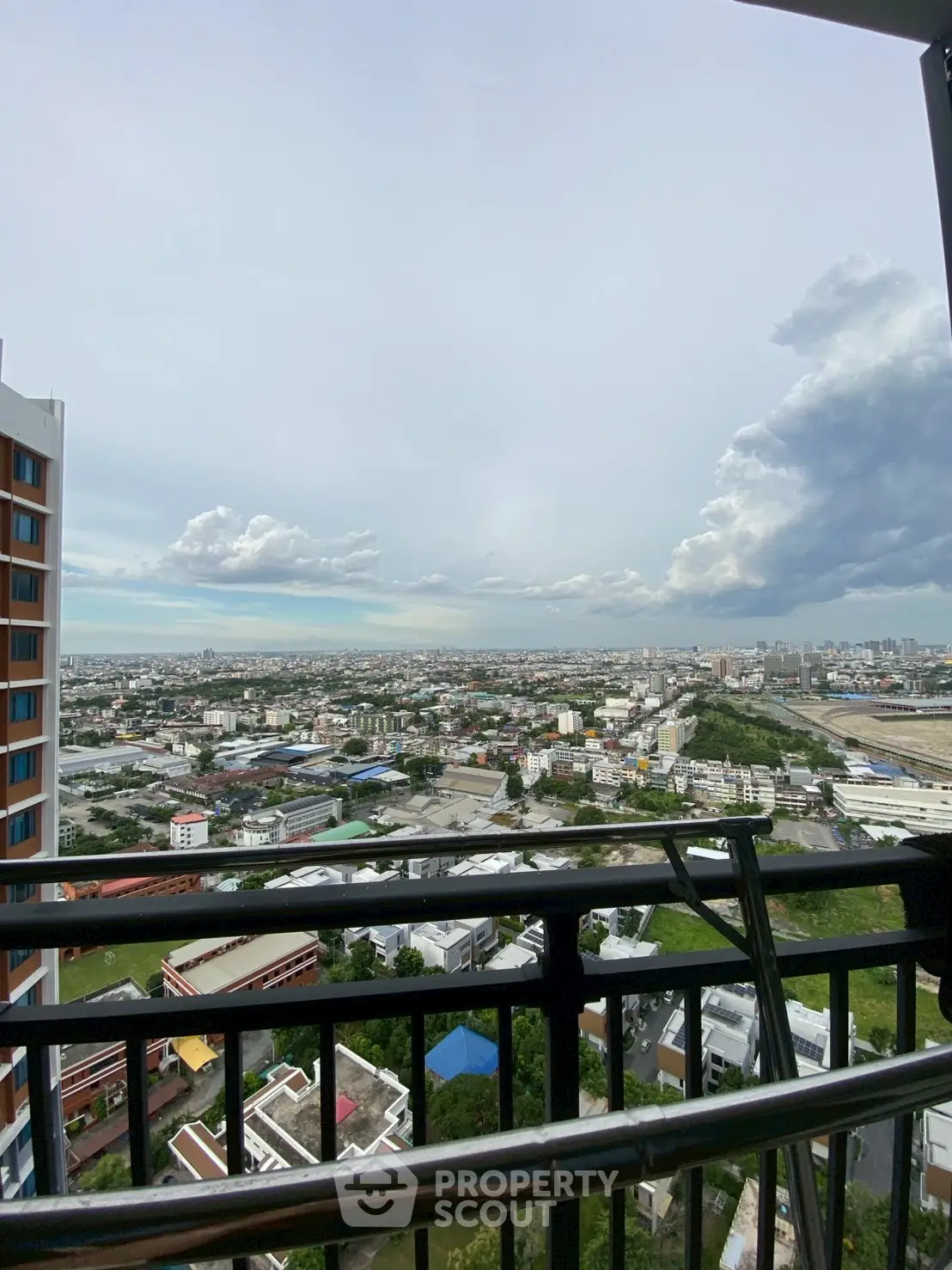 Stunning cityscape view from high-rise balcony, perfect for urban living enthusiasts.