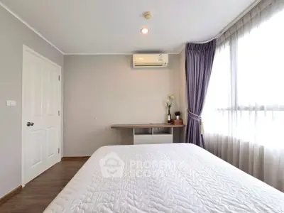 Bright and airy bedroom with modern decor and large window