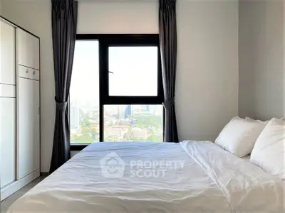 Modern bedroom with large window offering stunning city view, featuring cozy bed and sleek wardrobe.