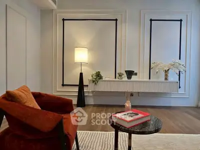 Stylish modern living room with elegant decor and cozy seating area.