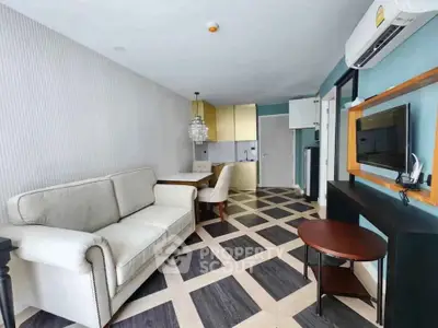 Modern living room with stylish decor and open kitchen layout