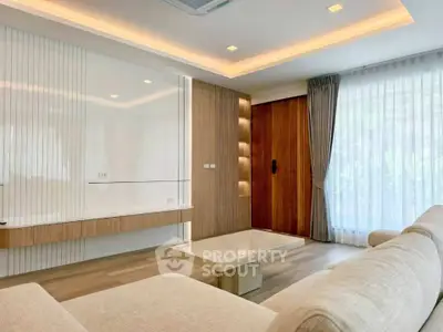 Modern living room with elegant wood paneling and natural light