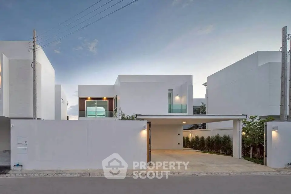 Modern minimalist white house with sleek design and spacious driveway