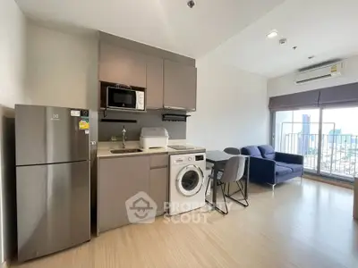 Modern apartment with open kitchen and living area, featuring city view and sleek appliances.