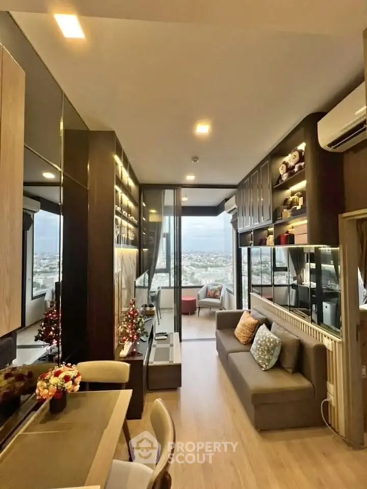 Modern living room with stylish decor and city view, featuring cozy seating and elegant lighting.