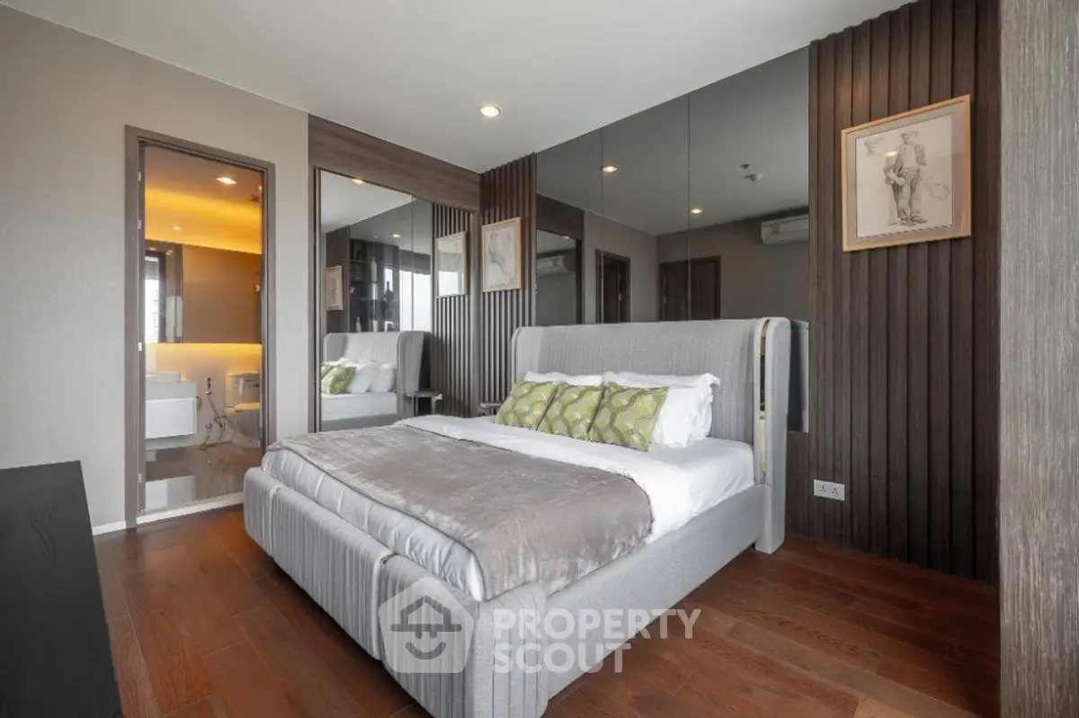 Modern bedroom with stylish decor and wooden flooring