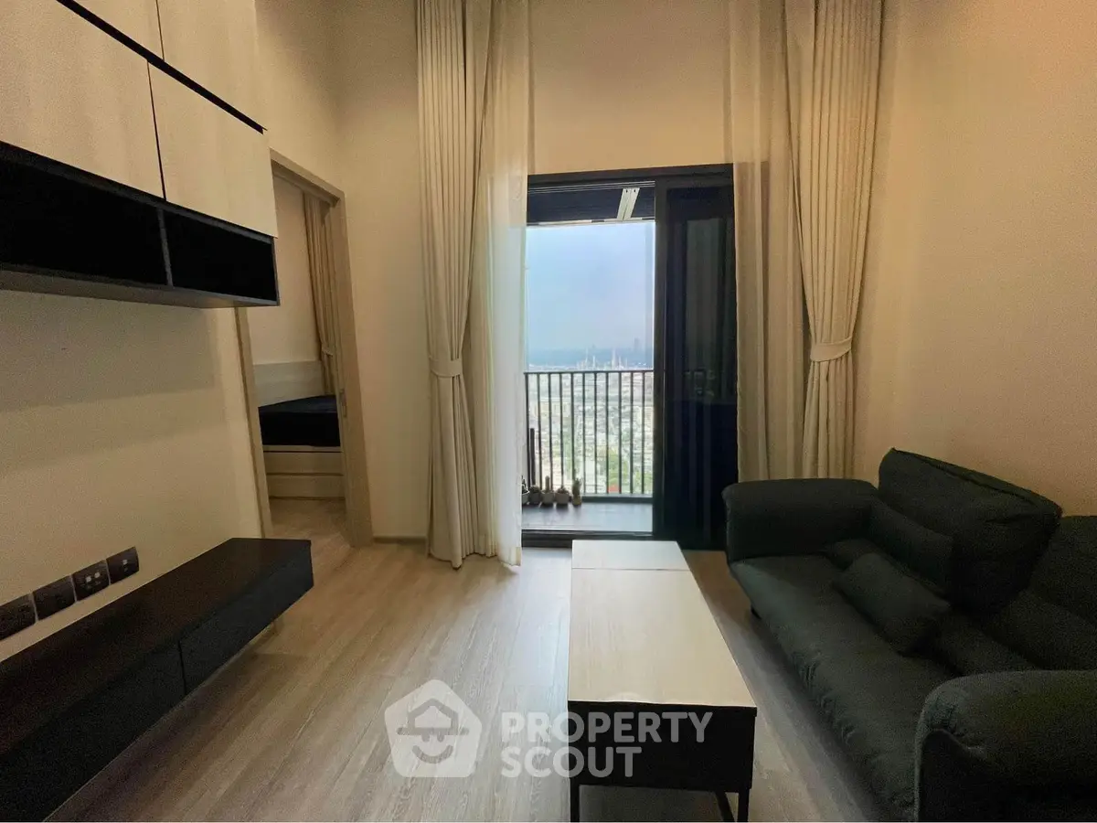 Modern living room with balcony view in high-rise apartment