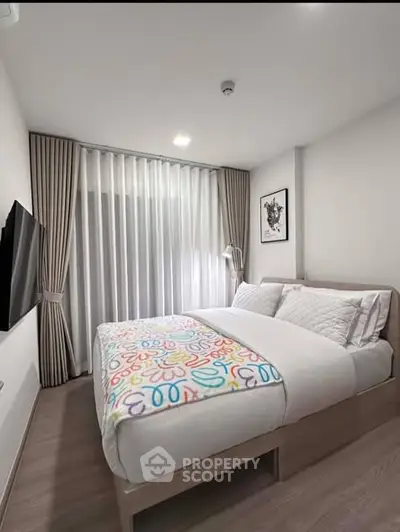 Cozy modern bedroom with stylish decor and natural light