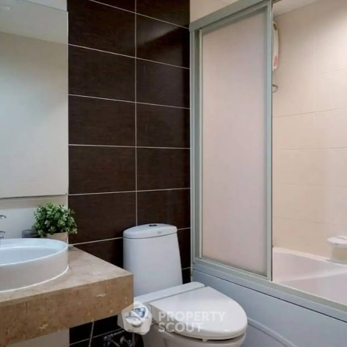 Modern bathroom with sleek design and bathtub in contemporary apartment.