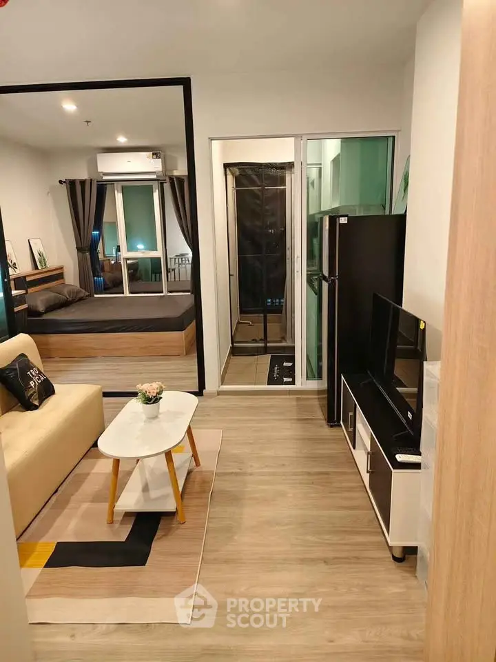 Modern apartment interior with cozy living room and stylish bedroom, featuring contemporary furniture and decor.