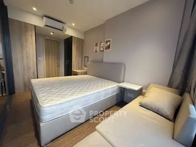 Modern bedroom with stylish decor and comfortable furnishings in a contemporary apartment.