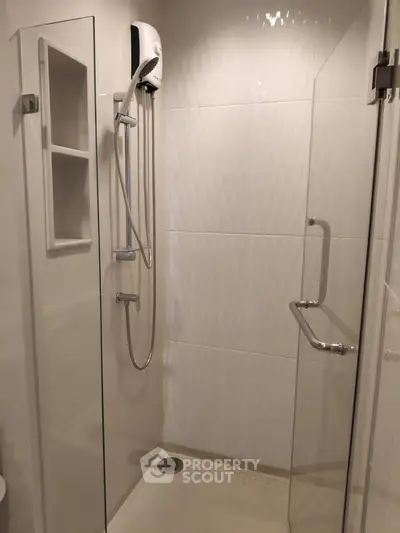 Modern bathroom with sleek shower enclosure and contemporary fixtures
