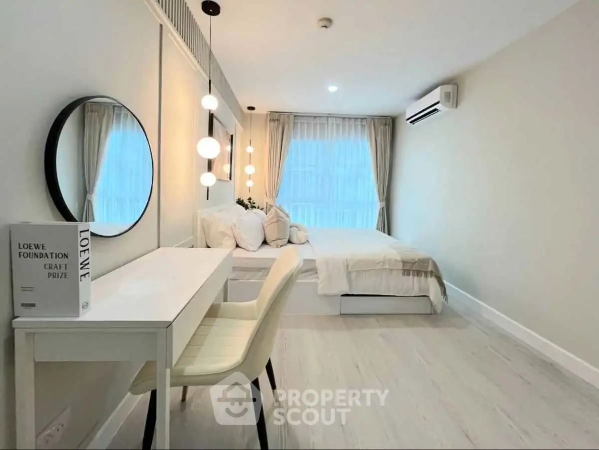 Modern bedroom with stylish decor and natural light