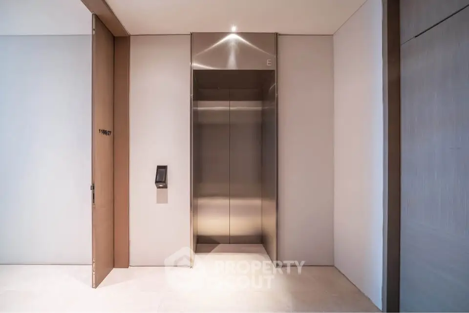 Modern building elevator with sleek design and ambient lighting