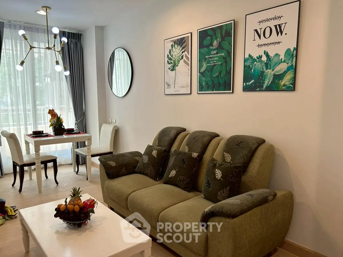 Stylish living room with modern decor and natural light, featuring a cozy sofa and elegant dining area.