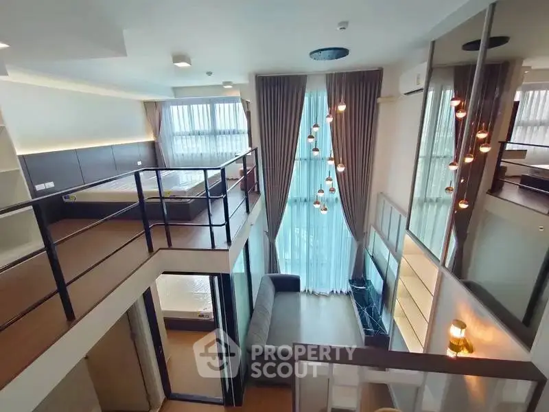 Stunning loft apartment with high ceilings and modern design, featuring a spacious living area and elegant lighting.