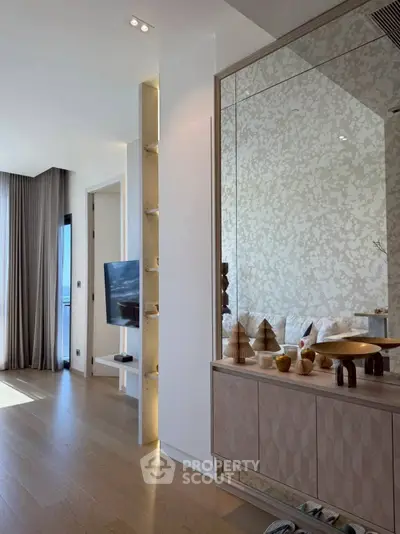 Luxurious living room with elegant decor and large window offering natural light