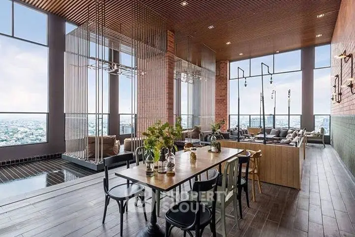Luxurious rooftop lounge with panoramic city views and elegant decor.