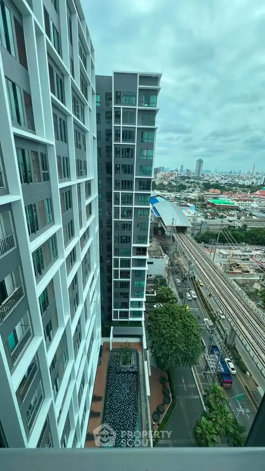 Stunning high-rise building with pool and city view, perfect for urban living.