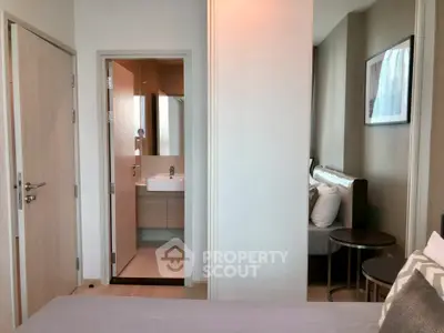 Modern bedroom with ensuite bathroom in stylish apartment