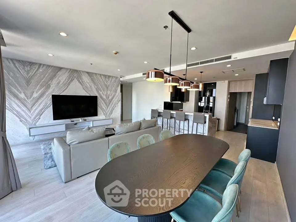 Luxurious modern living room with open kitchen and stylish dining area