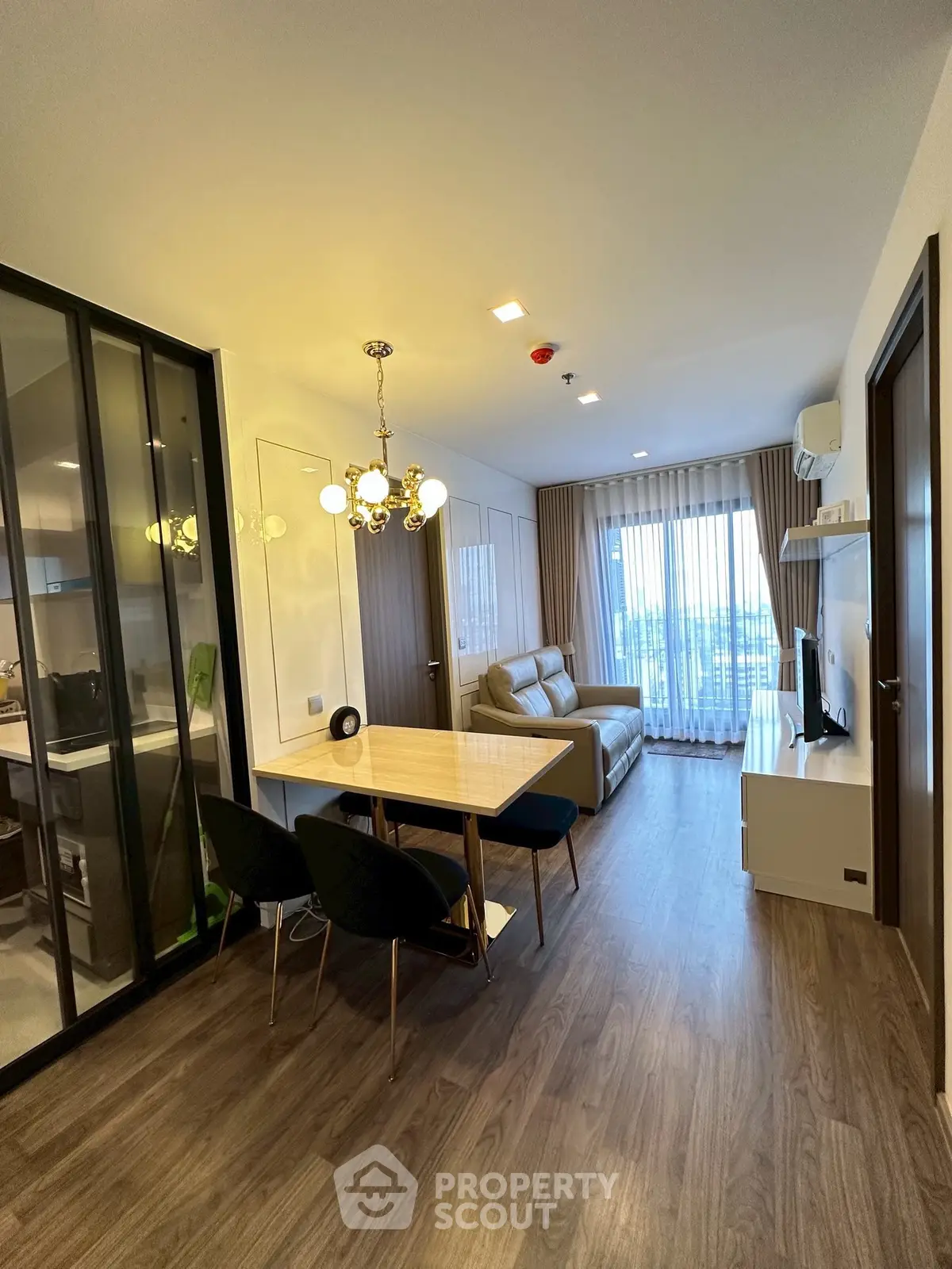 Modern living room with elegant dining area and stylish decor in a cozy apartment.