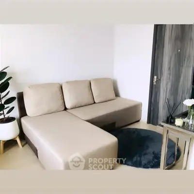 Modern living room with beige sectional sofa and stylish decor