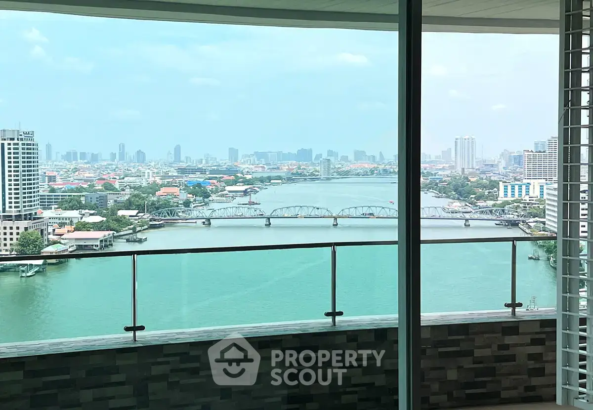 Stunning river view from high-rise balcony with city skyline