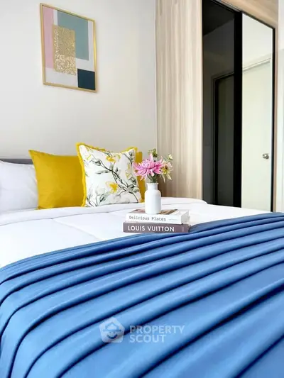 Stylish bedroom with modern decor and vibrant accents, perfect for a cozy and inviting atmosphere.