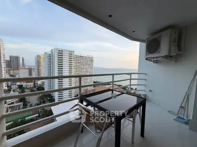 Stunning high-rise balcony with ocean view, perfect for relaxation and enjoying cityscape vistas.