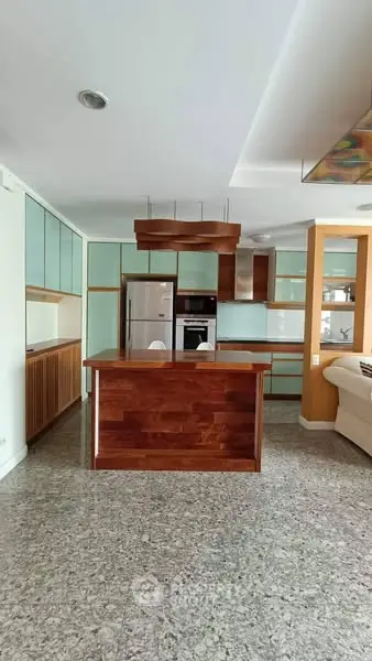 Modern kitchen with sleek cabinetry and island in open layout