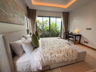 Luxurious bedroom with garden view, featuring elegant decor and cozy ambiance for ultimate relaxation.