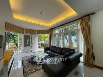 Spacious living room with modern design and garden view