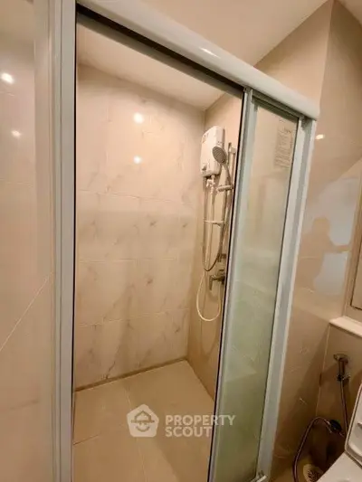 Modern bathroom with sleek shower enclosure and elegant tile design
