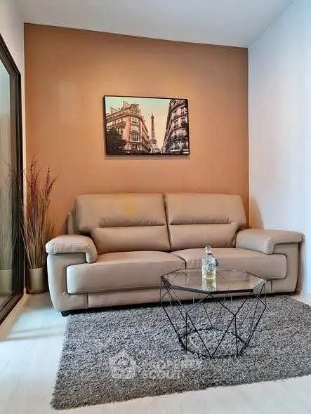 Cozy living room with modern sofa and stylish decor in a contemporary apartment.