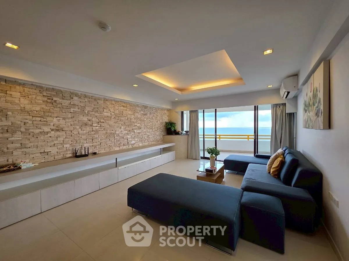 Spacious modern living room with large windows and stylish decor