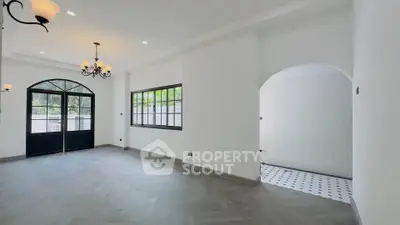 Spacious modern living room with elegant lighting and large windows