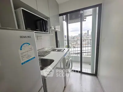 Modern kitchen with city view, featuring appliances and sleek design, perfect for urban living.
