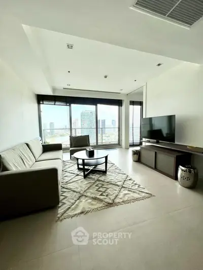 Modern living room with city view, stylish furniture, and large windows.
